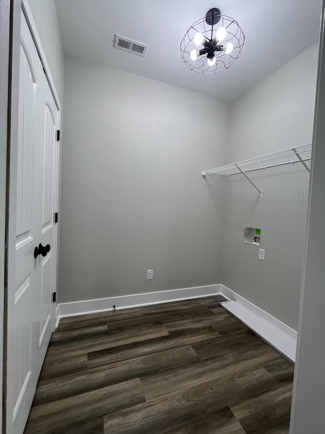168 Bueno Xing, Georgetown, KY 40324 - laundry area with dark wood finished floors, baseboards, washer hookup, and a chandelier