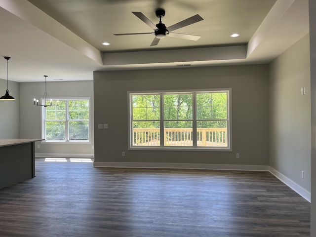 168 Bueno Xing, Georgetown, KY 40324 - unfurnished living room featuring baseboards, a chandelier, a raised ceiling, dark wood-style flooring, and recessed lighting