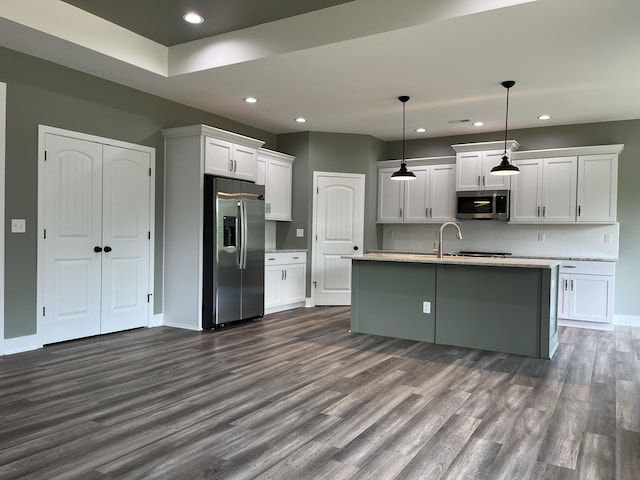 168 Bueno Xing, Georgetown, KY 40324 - kitchen featuring appliances with stainless steel finishes, dark wood-type flooring, recessed lighting, light countertops, and white cabinetry