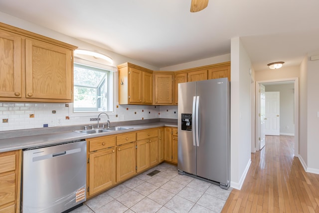 2692 Crab Orchard Rd, Lancaster, KY 40444 - kitchen featuring a sink, decorative backsplash, stainless steel appliances, baseboards, and visible vents