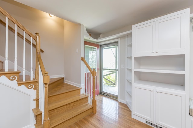 2692 Crab Orchard Rd, Lancaster, KY 40444 - foyer with light wood finished floors, baseboards, stairs, and visible vents