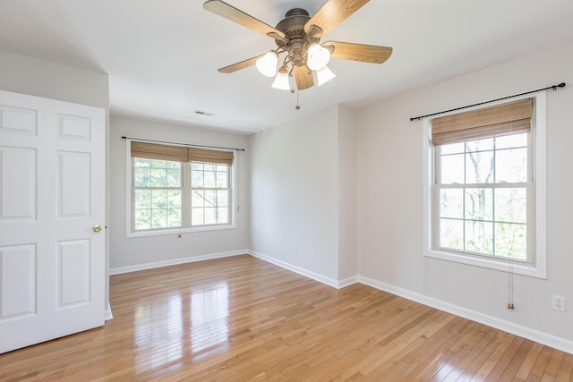 2692 Crab Orchard Rd, Lancaster, KY 40444 - unfurnished room featuring light wood-style flooring, visible vents, a ceiling fan, and baseboards