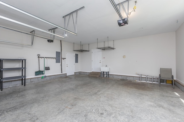 2692 Crab Orchard Rd, Lancaster, KY 40444 - garage with electric panel, a sink, and a garage door opener