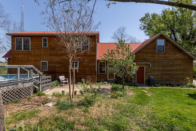 2692 Crab Orchard Rd, Lancaster, KY 40444 - rear view of house with a yard, metal roof, and a deck