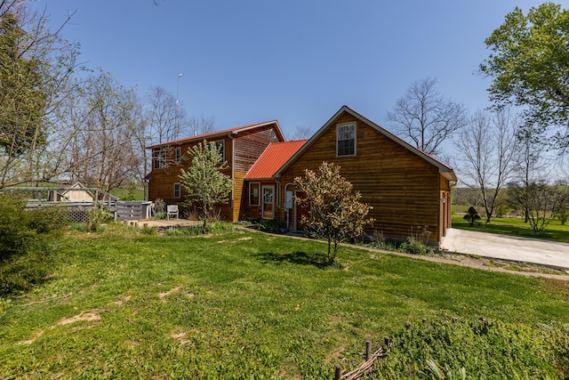 2692 Crab Orchard Rd, Lancaster, KY 40444 - view of front of house featuring concrete driveway, a front lawn, and metal roof