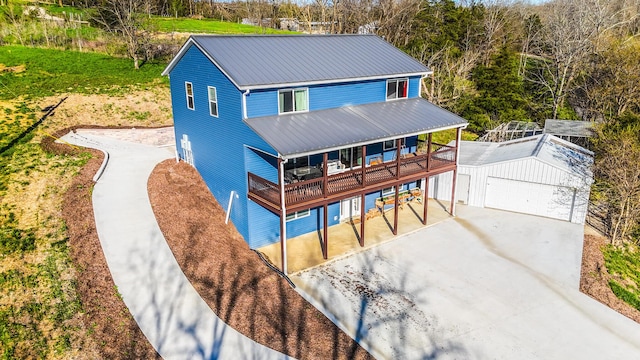 1600 Puncheon Creek Rd, Lawrenceburg, KY 40342 - rear view of property with metal roof, concrete driveway, and a porch