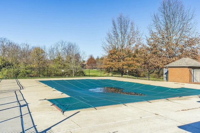 view of swimming pool featuring a fenced in pool, a patio area, and fence
