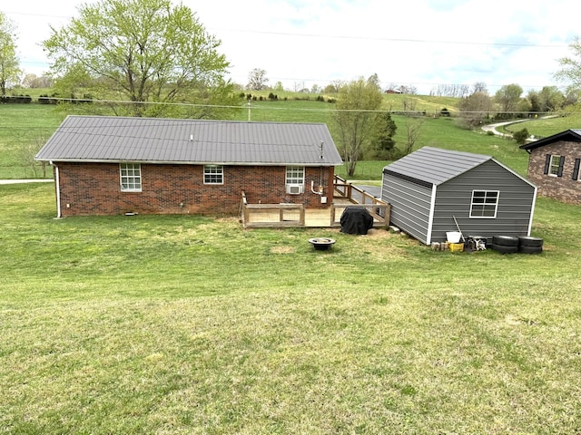 81 Central Union Rd, Albany, KY 42602 - rear view of house featuring an outdoor structure, brick siding, and a yard