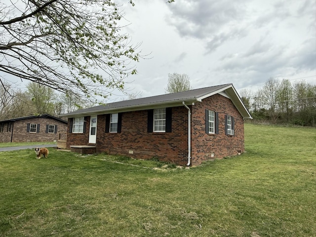 81 Central Union Rd, Albany, KY 42602 - view of front of house featuring brick siding, crawl space, metal roof, and a front lawn