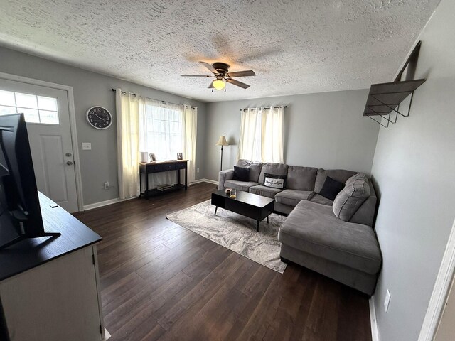 81 Central Union Rd, Albany, KY 42602 - living area with dark wood-type flooring, baseboards, a textured ceiling, and ceiling fan