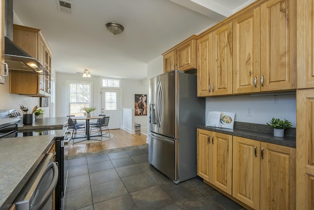 kitchen with dark tile patterned flooring, visible vents, stainless steel refrigerator with ice dispenser, black electric range, and dark countertops