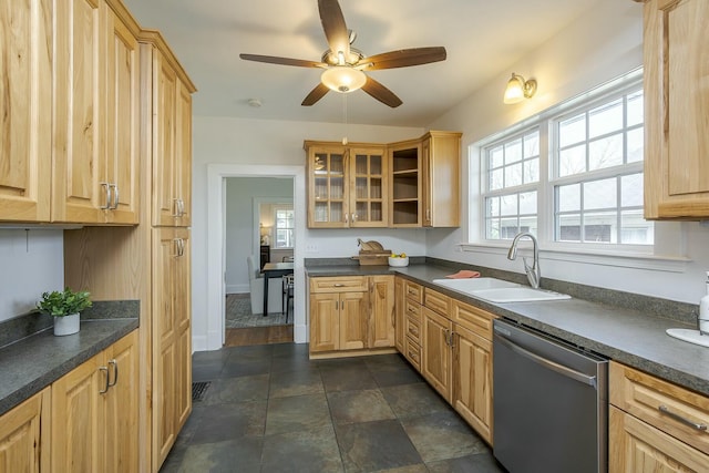 kitchen featuring stainless steel dishwasher, a sink, glass insert cabinets, and dark countertops
