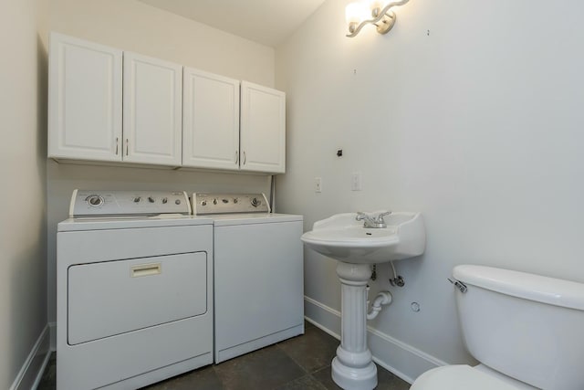 half bath with independent washer and dryer, baseboards, and toilet
