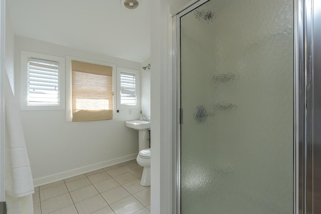 full bath with a shower stall, baseboards, tile patterned flooring, and plenty of natural light