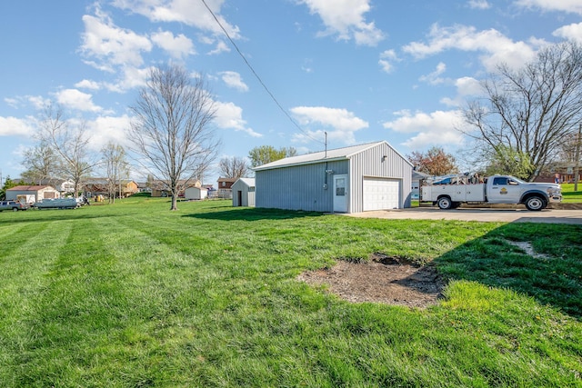 9 Blanche Ave, Williamstown, KY 41097 - view of yard featuring a garage, driveway, and an outbuilding