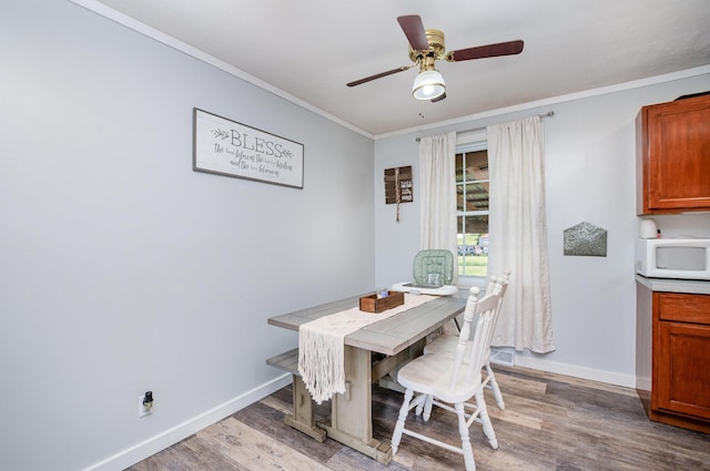 9 Blanche Ave, Williamstown, KY 41097 - dining space featuring baseboards, ornamental molding, a ceiling fan, and wood finished floors