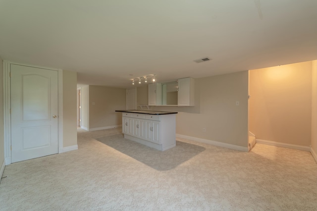 614 Apricot Dr, Richmond, KY 40475 - kitchen featuring visible vents, baseboards, dark countertops, and light colored carpet