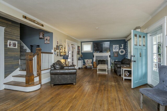 264 Houston Ave, Paris, KY 40361 - living area featuring crown molding, wood finished floors, stairway, and a fireplace