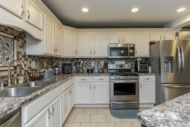264 Houston Ave, Paris, KY 40361 - kitchen featuring appliances with stainless steel finishes, a sink, recessed lighting, decorative backsplash, and light tile patterned floors