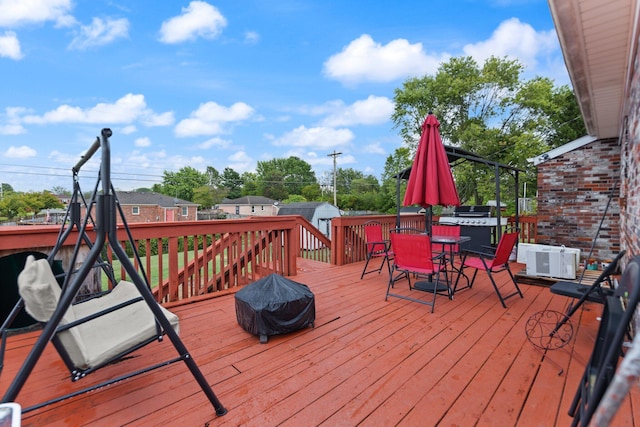 wooden deck featuring outdoor dining area
