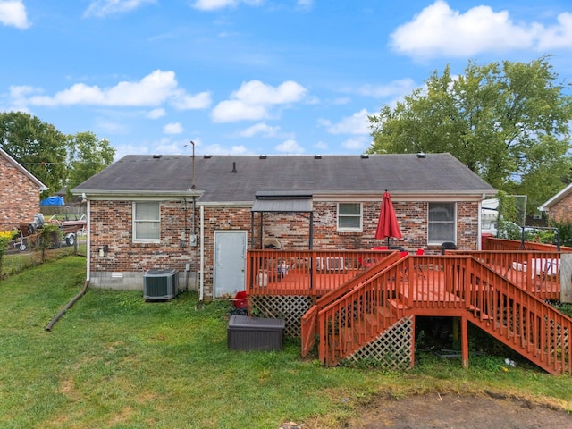 back of property with central air condition unit, stairs, brick siding, a deck, and a lawn