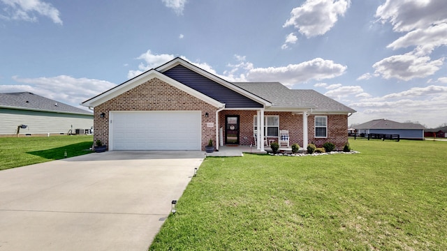 ranch-style home featuring an attached garage, concrete driveway, a front lawn, and brick siding