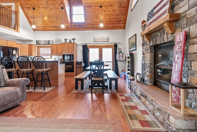 130 The Village Dr, Nancy, KY 42544 - dining area with high vaulted ceiling, light wood-style flooring, a stone fireplace, and wooden ceiling