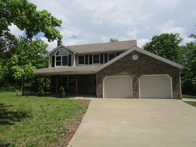 596 Overlook Dr, Lancaster, KY 40444 - view of front of home featuring an attached garage, a chimney, driveway, covered porch, and a front yard
