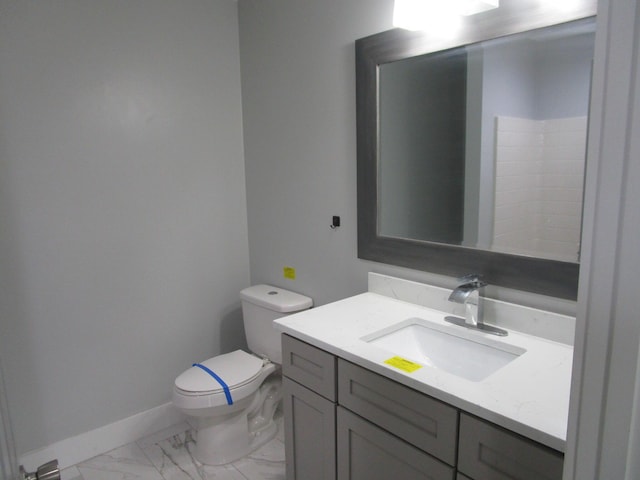 596 Overlook Dr, Lancaster, KY 40444 - bathroom with toilet, baseboards, vanity, and marble finish floors