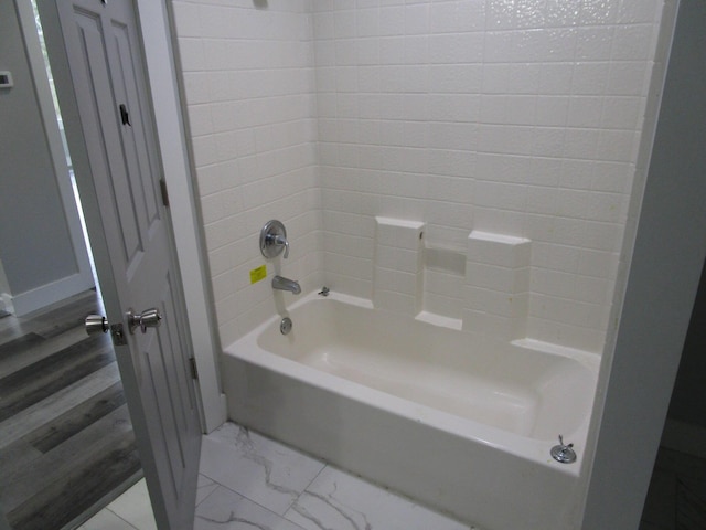 596 Overlook Dr, Lancaster, KY 40444 - bathroom featuring marble look tile flooring and shower / bath combination