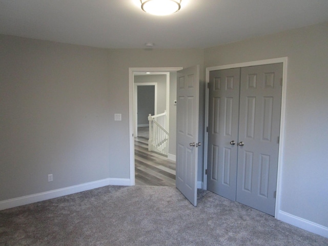 596 Overlook Dr, Lancaster, KY 40444 - unfurnished bedroom featuring carpet floors, a closet, and baseboards