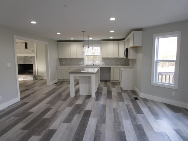 596 Overlook Dr, Lancaster, KY 40444 - kitchen featuring a center island, white cabinetry, tasteful backsplash, recessed lighting, and open floor plan