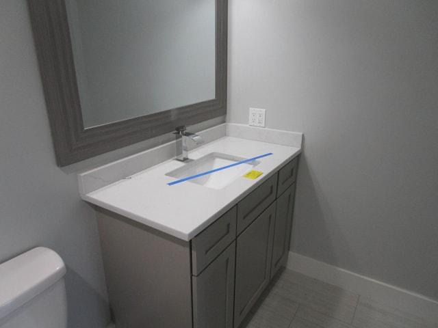 596 Overlook Dr, Lancaster, KY 40444 - half bathroom featuring toilet, vanity, and tile patterned floors