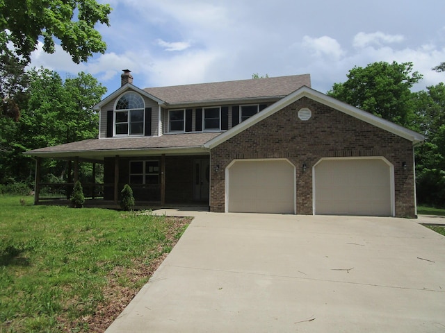 596 Overlook Dr, Lancaster, KY 40444 - view of front of home featuring an attached garage, a chimney, concrete driveway, a porch, and a front lawn