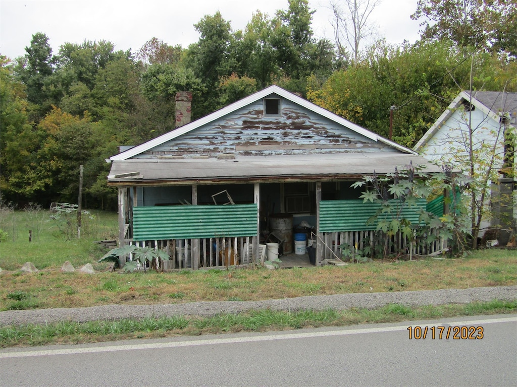 view of front facade with a chimney