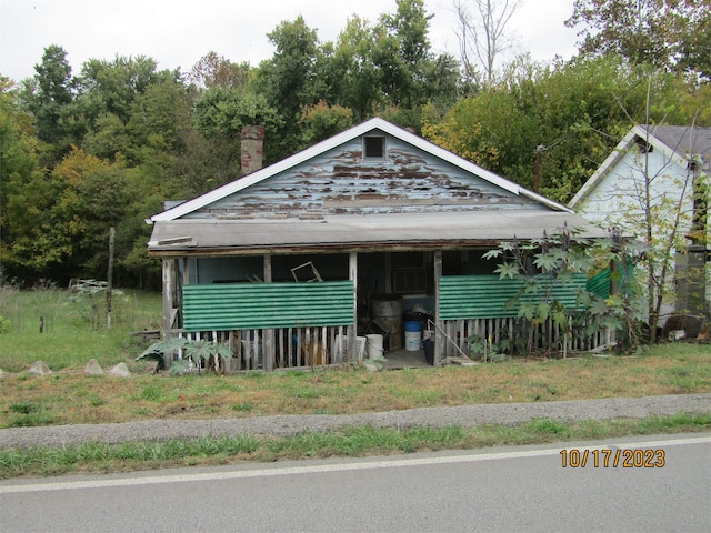 view of front facade with a chimney