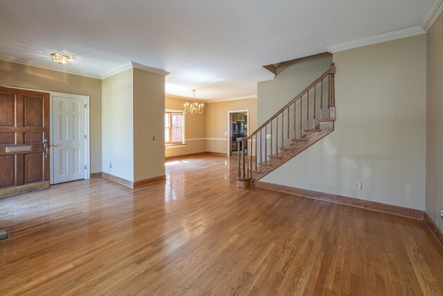 400 Redding Rd Unit 15, Lexington, KY 40517 - interior space featuring an inviting chandelier, light wood-type flooring, ornamental molding, stairs, and baseboards