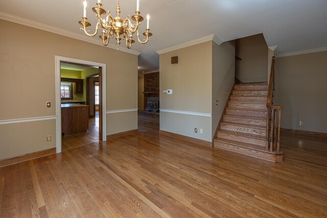 400 Redding Rd Unit 15, Lexington, KY 40517 - interior space featuring baseboards, a chandelier, stairway, crown molding, and wood finished floors