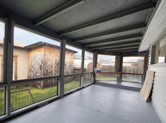 513 Washington Ave, Paintsville, KY 41240 - unfurnished sunroom with beam ceiling