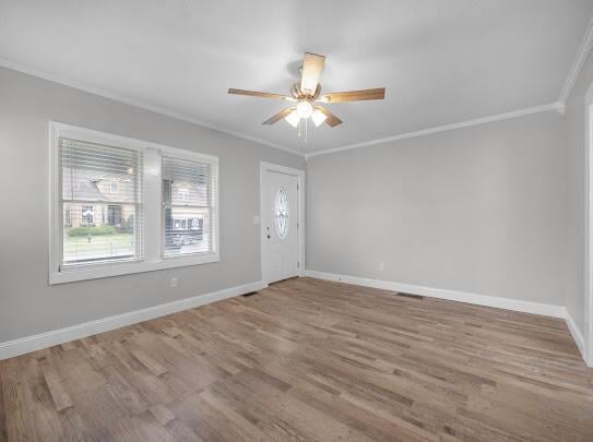 513 Washington Ave, Paintsville, KY 41240 - entryway with crown molding, ceiling fan, wood finished floors, and baseboards