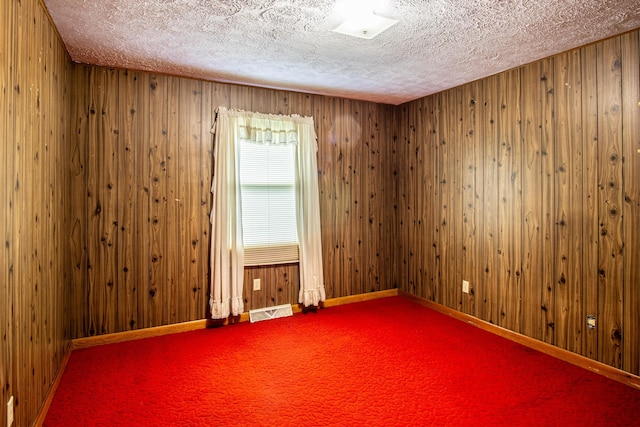 176 Marsee Trl, Corbin, KY 40701 - spare room with a textured ceiling, baseboards, visible vents, and carpet floors