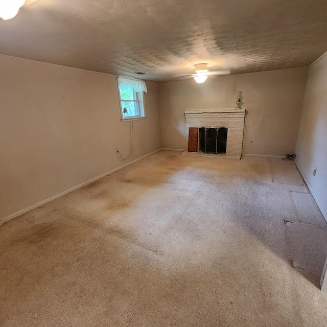 198 Hiawatha Trl, Georgetown, KY 40324 - unfurnished living room with a brick fireplace, carpet, baseboards, and a ceiling fan
