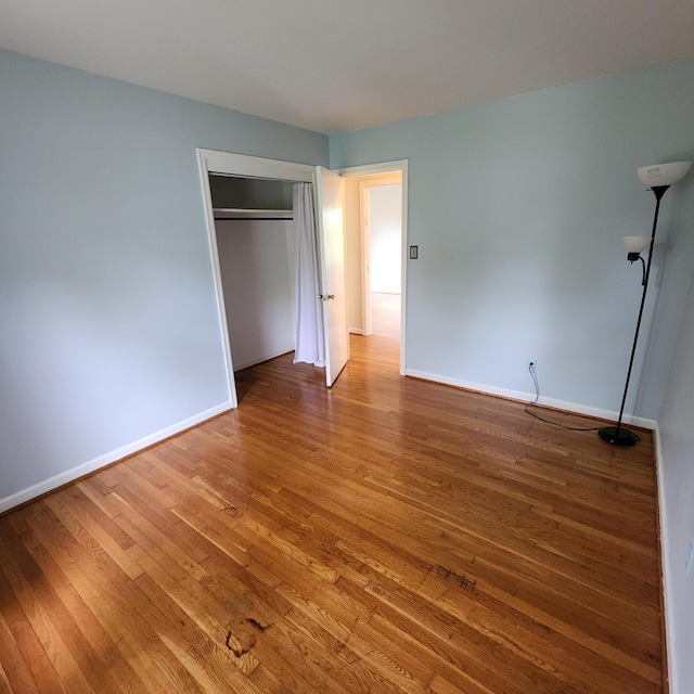 198 Hiawatha Trl, Georgetown, KY 40324 - unfurnished bedroom with wood finished floors, baseboards, and a closet