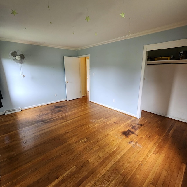 198 Hiawatha Trl, Georgetown, KY 40324 - unfurnished bedroom with ornamental molding, hardwood / wood-style flooring, a closet, and baseboards
