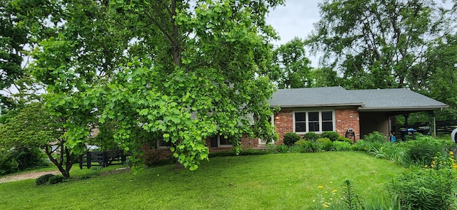 198 Hiawatha Trl, Georgetown, KY 40324 - view of front of property with a front lawn, brick siding, and an attached carport