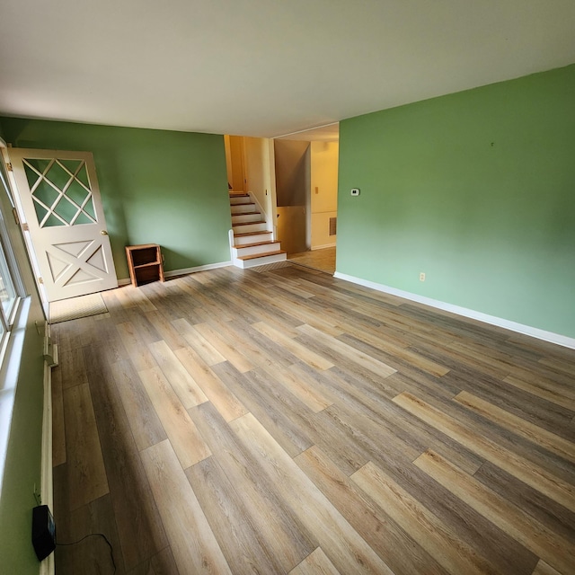 198 Hiawatha Trl, Georgetown, KY 40324 - unfurnished room with wood finished floors, baseboards, and stairway