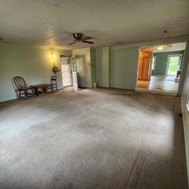 198 Hiawatha Trl, Georgetown, KY 40324 - unfurnished living room with ceiling fan, light colored carpet, and baseboards