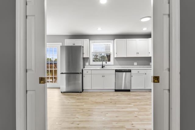 280 Main St, Salt Lick, KY 40371 - kitchen featuring appliances with stainless steel finishes, a sink, recessed lighting, white cabinets, and light countertops