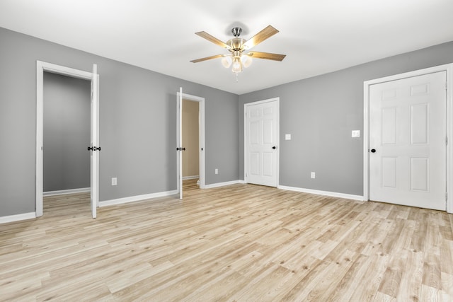 280 Main St, Salt Lick, KY 40371 - unfurnished bedroom with baseboards, light wood-style flooring, and ceiling fan