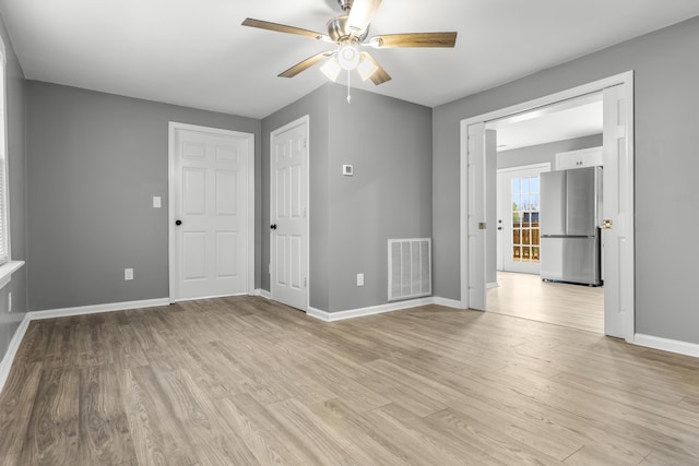 280 Main St, Salt Lick, KY 40371 - unfurnished room featuring ceiling fan, baseboards, and light wood-type flooring